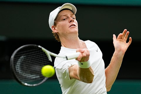 Jannik Sinner plays a forehand return to Daniil Medvedev
